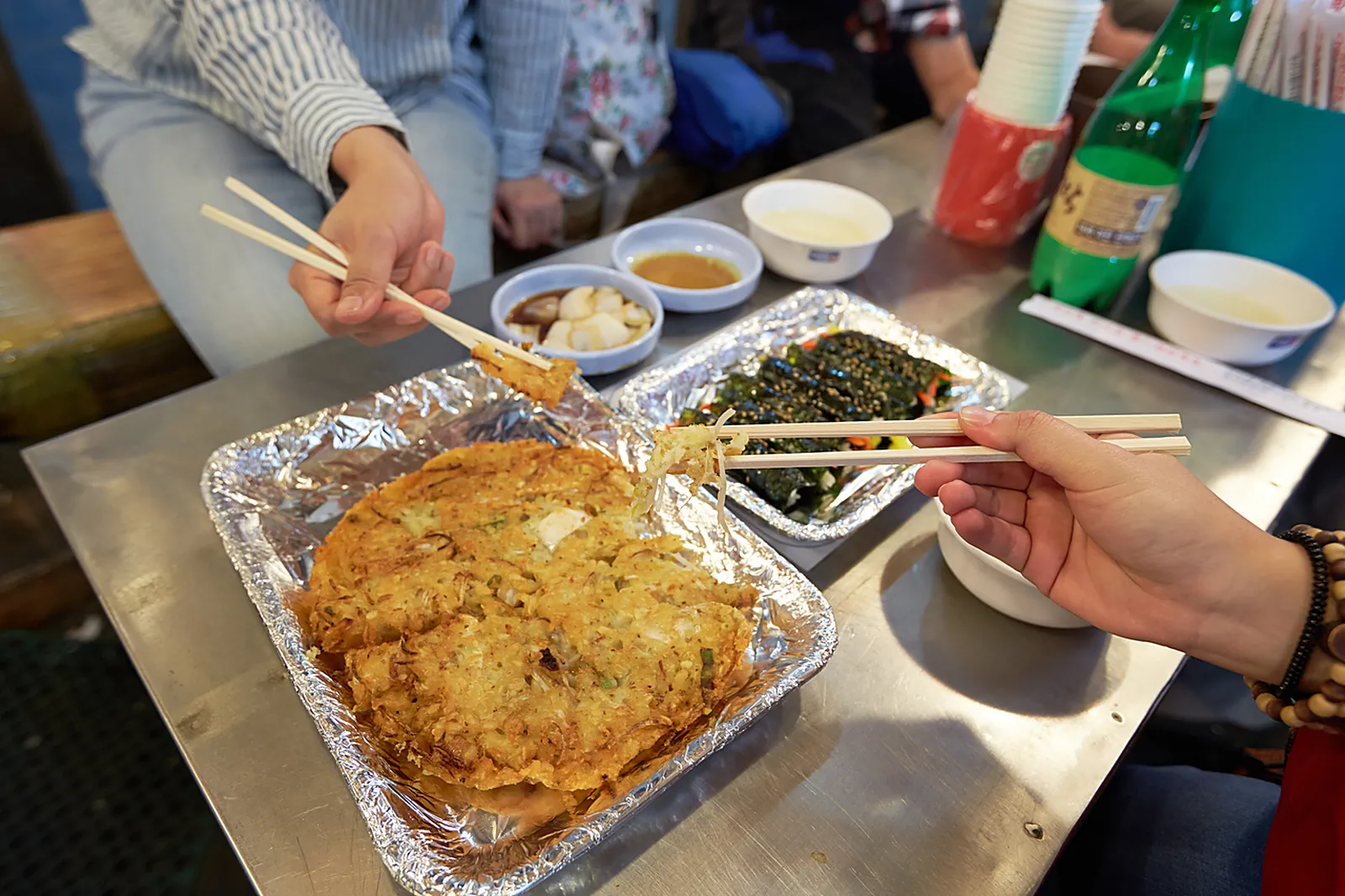 Bindaetteok on the griddle